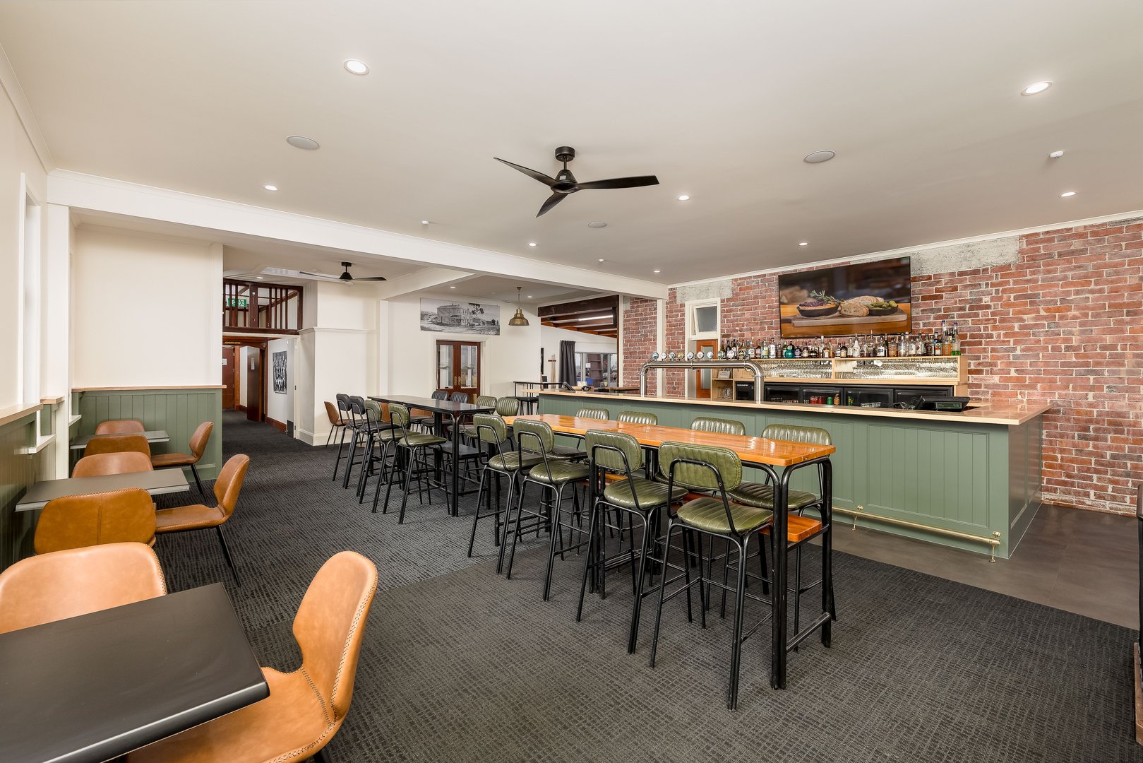Remodelled green timber bar and relaxed dining lounge at Makikihi Country Hotel