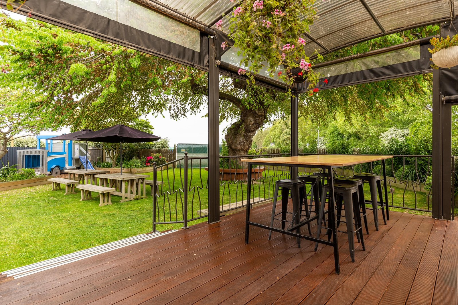Covered outdoor deck and beer garden at Makikihi Country Hotel